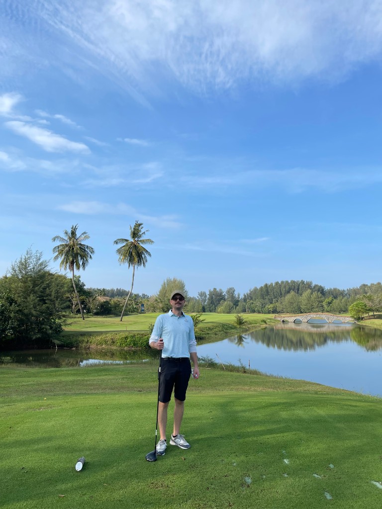 Golf course view with player